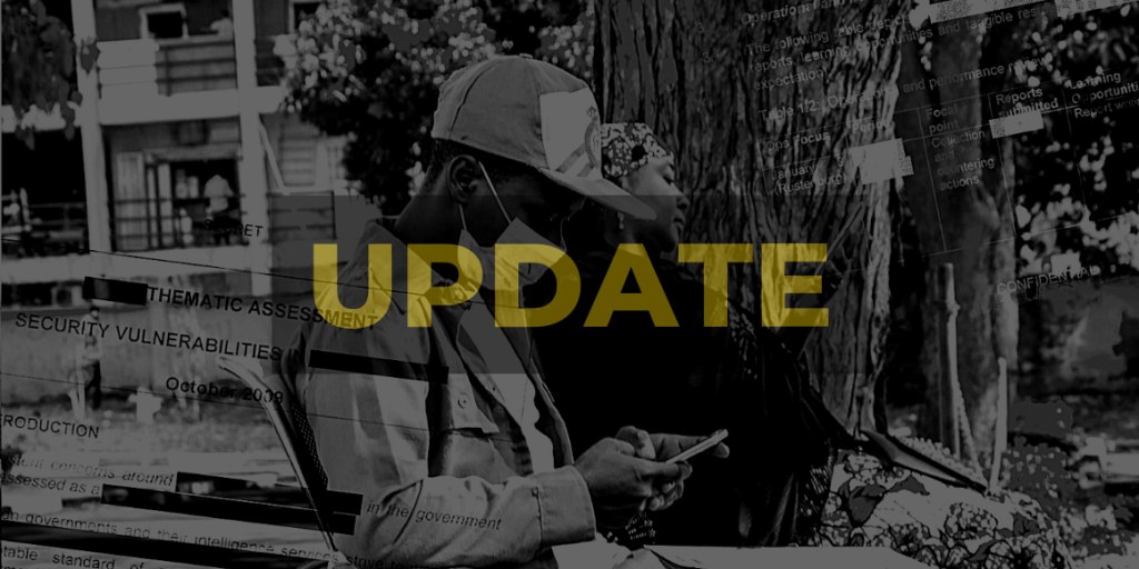 A man sitting on a chair under a tree checking his phone, with a woman in the background, in Nigeria. Image is superimposed with partly redacted State Security documents. Darkened, black and white with high contrast. 'UPDATE' appears in yellow. Photo credit: Ichie Opara / ALT Advisory (CC BY-NC-ND)